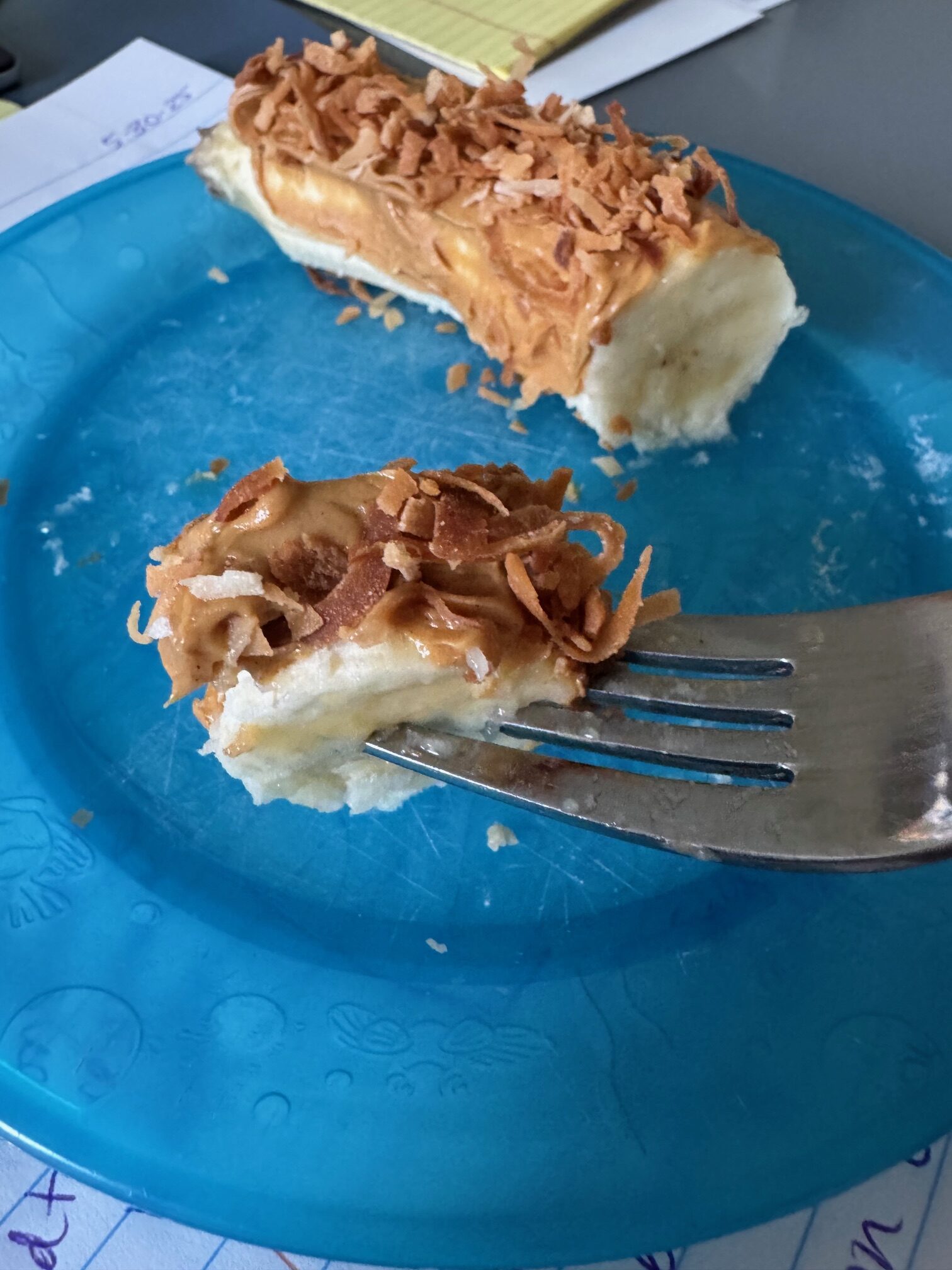 Banana with peanut butter and toasted coconut